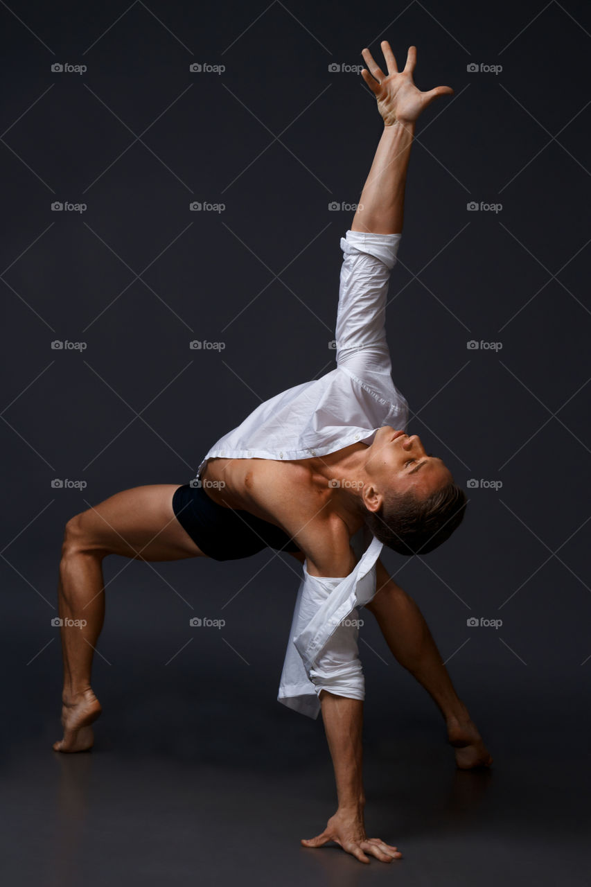 Men is dancing in a white shirt