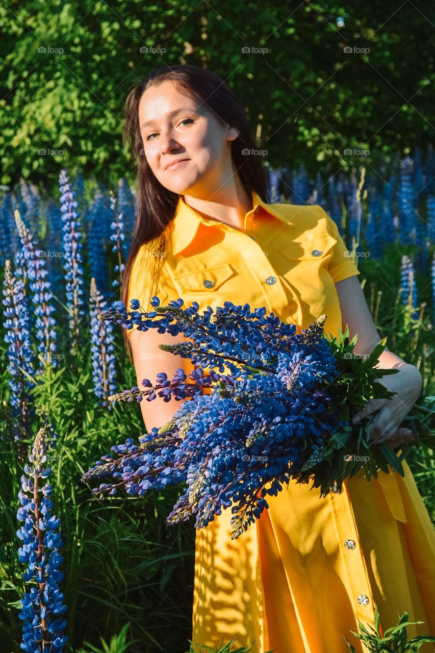 Woman with lupines 
