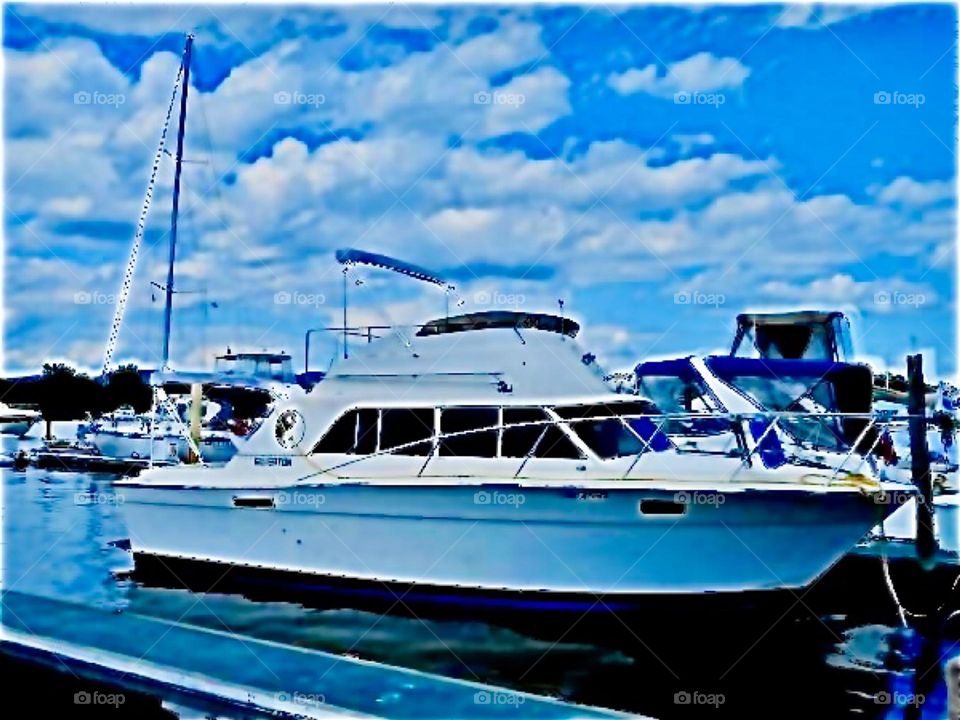 A beautiful white sea cruiser in the waters of the Atlantic Ocean seen on a visit to Sheepshead Bay, Brooklyn, NY in the summertime of 2020. Hypnotic Productions