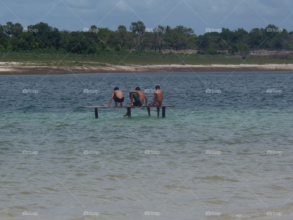 Boys are playing on the beach