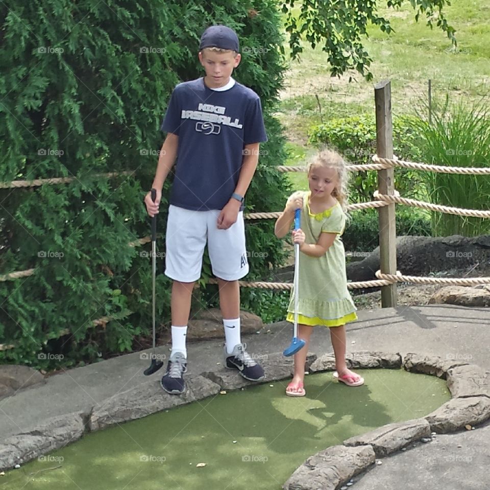 Golfing Siblings