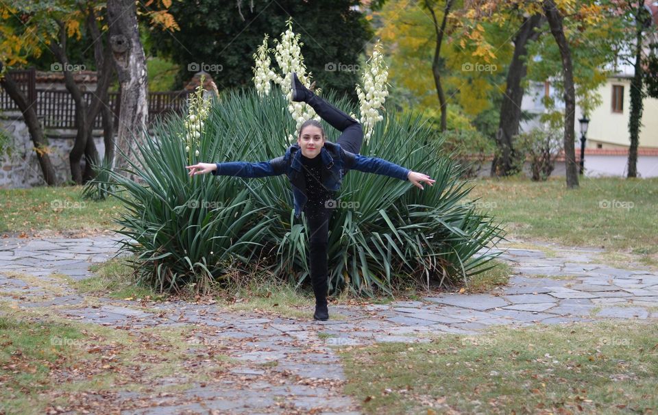 Beautiful Young Girl Dancing Outside in Nature