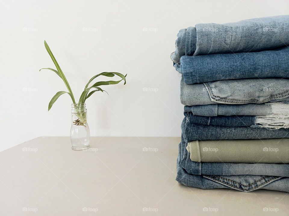 folded jeans on the shelf