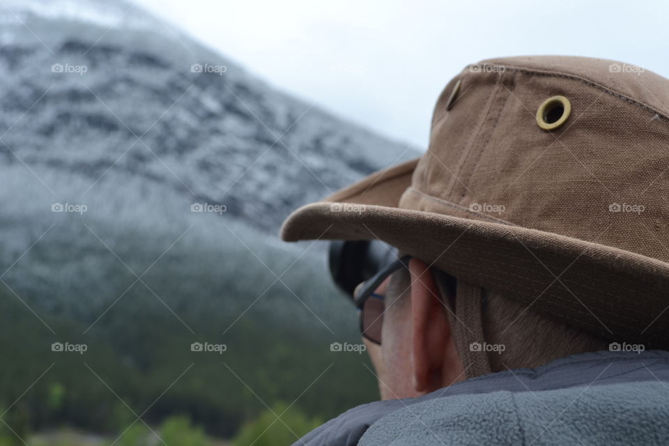 Male photographer shooting Rocky Mountains Canada photography