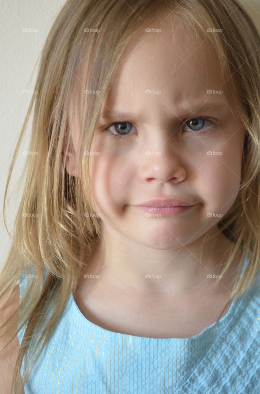 Portrait of angry cute little girl