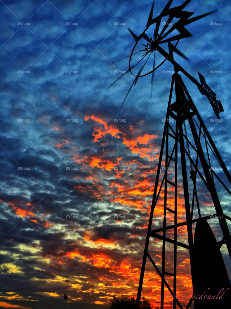 dramatic sunset against the windmill 