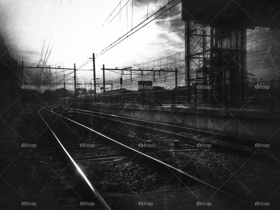 Railway in black and white. Heading home after work