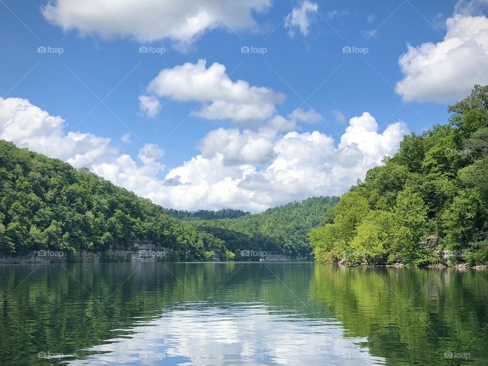 Partly cloudy day on a hot summer day out on the lake 