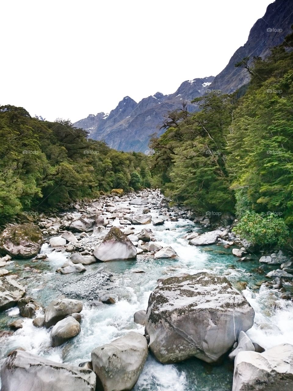 River flowing through rock during winter