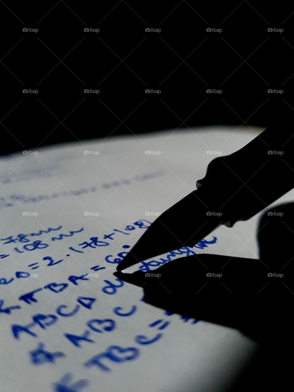 This picture represents a pen that does math. Light and shadow are fascinating.