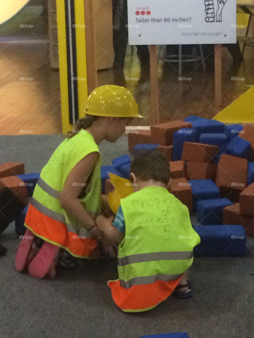 Kids playing with construction blocks