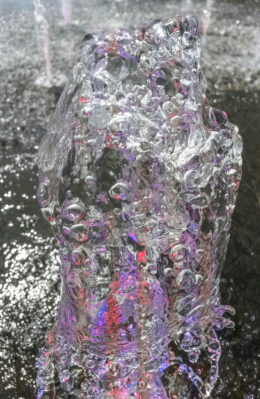 water in motion, fountain with colored light