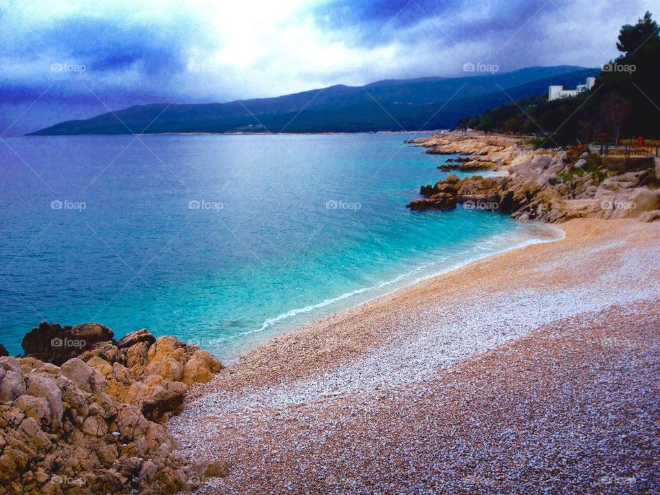 Cloud reflecting on beach