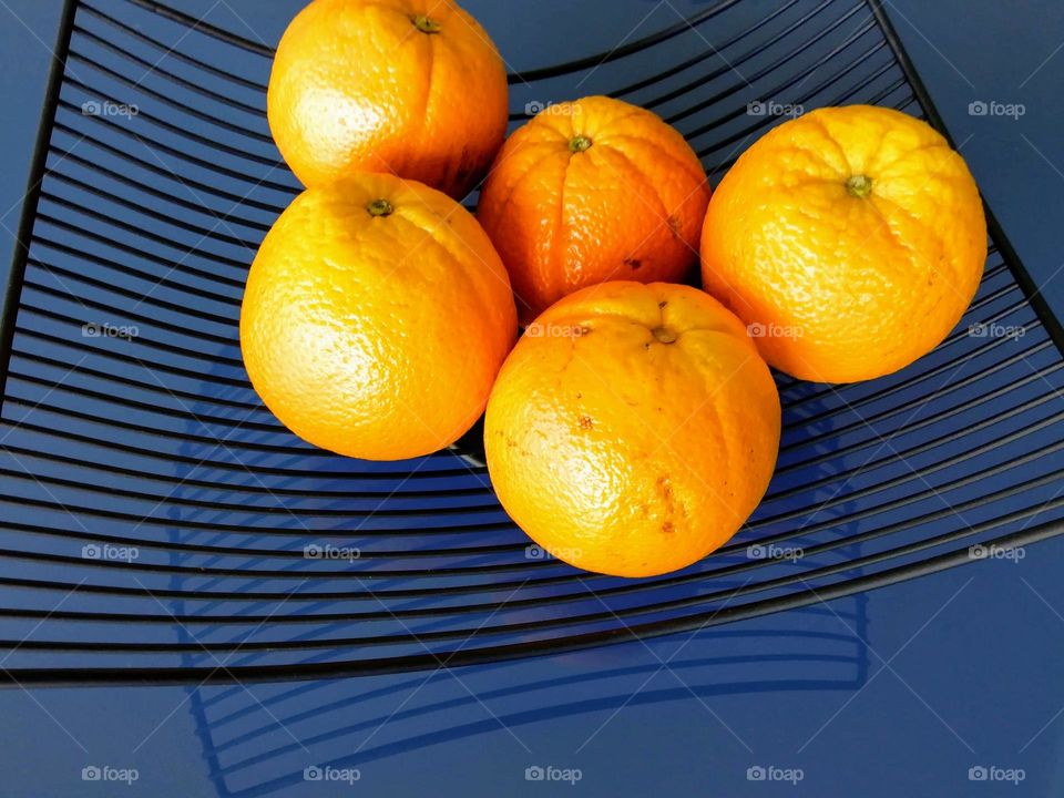 Oranges on a blue table