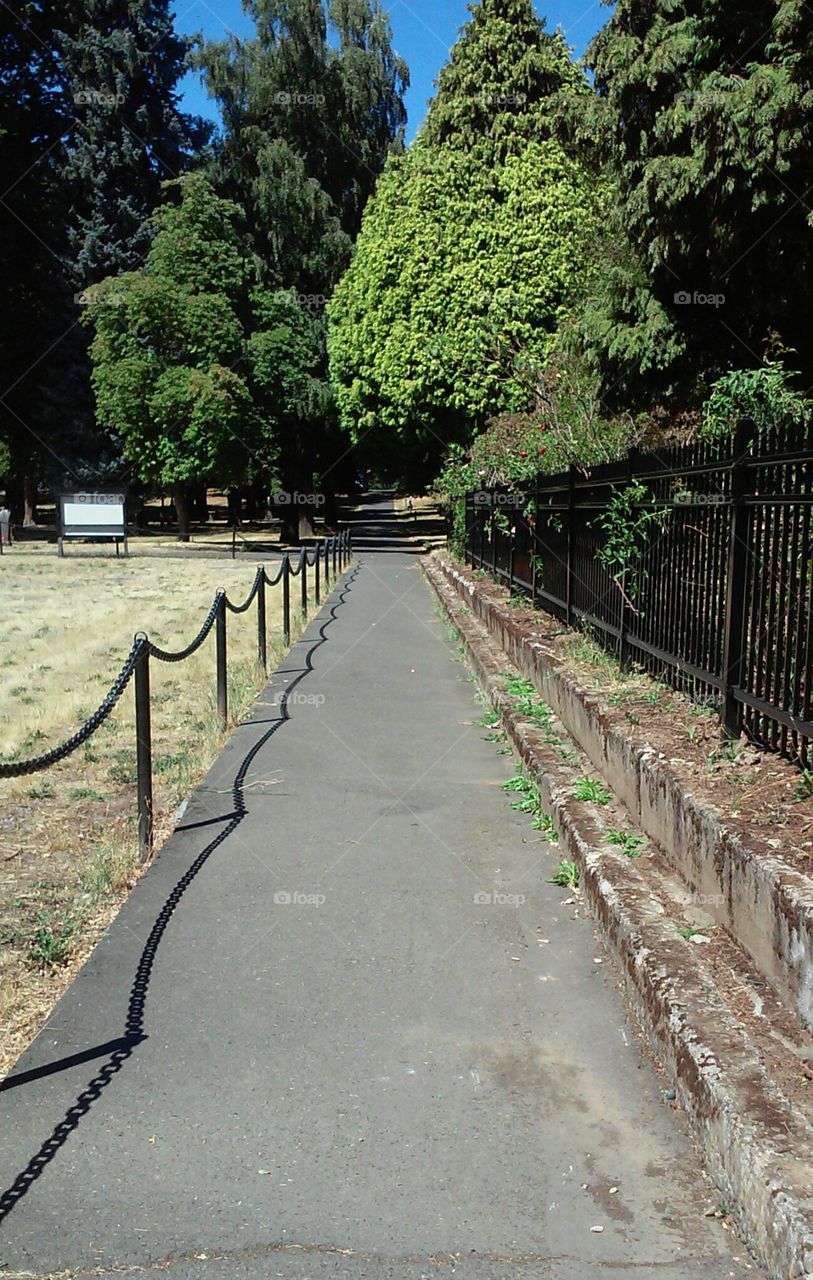 Historic Walkway. The South entrance to Lone Fir Cemetery, early afternoon in August. Portland, OR.