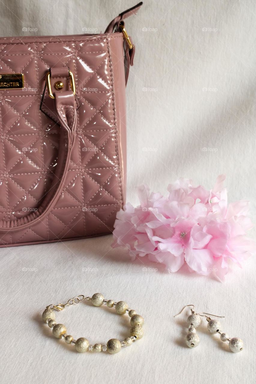 Handbag, jewelry and flowers