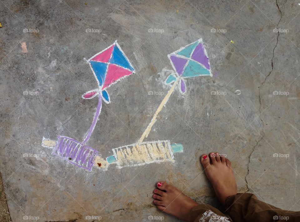 High angle view of kite rangoli on floor