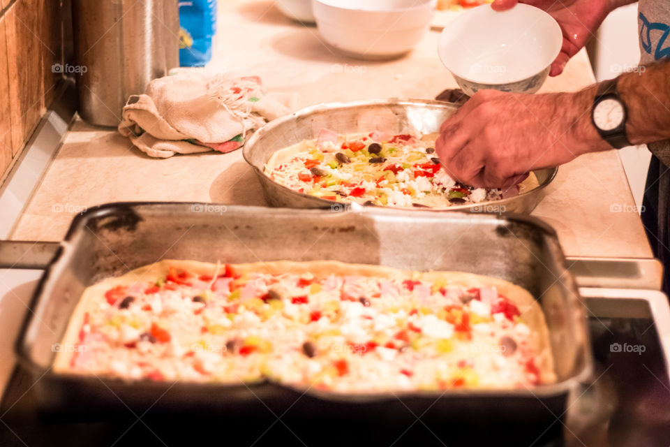 Man Prepares And Cooking Pizza At Home
