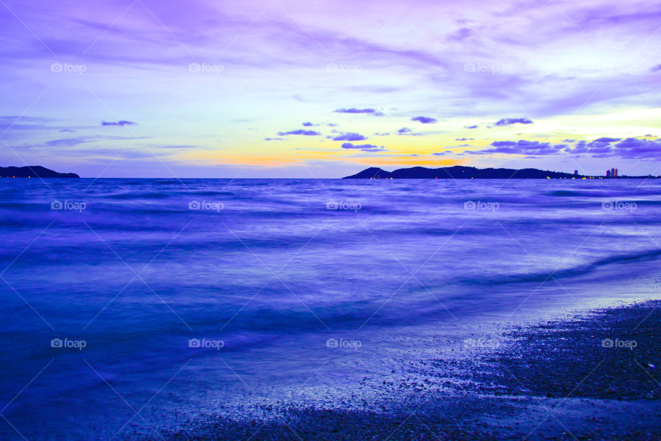 Soft wave at the sea in evening.