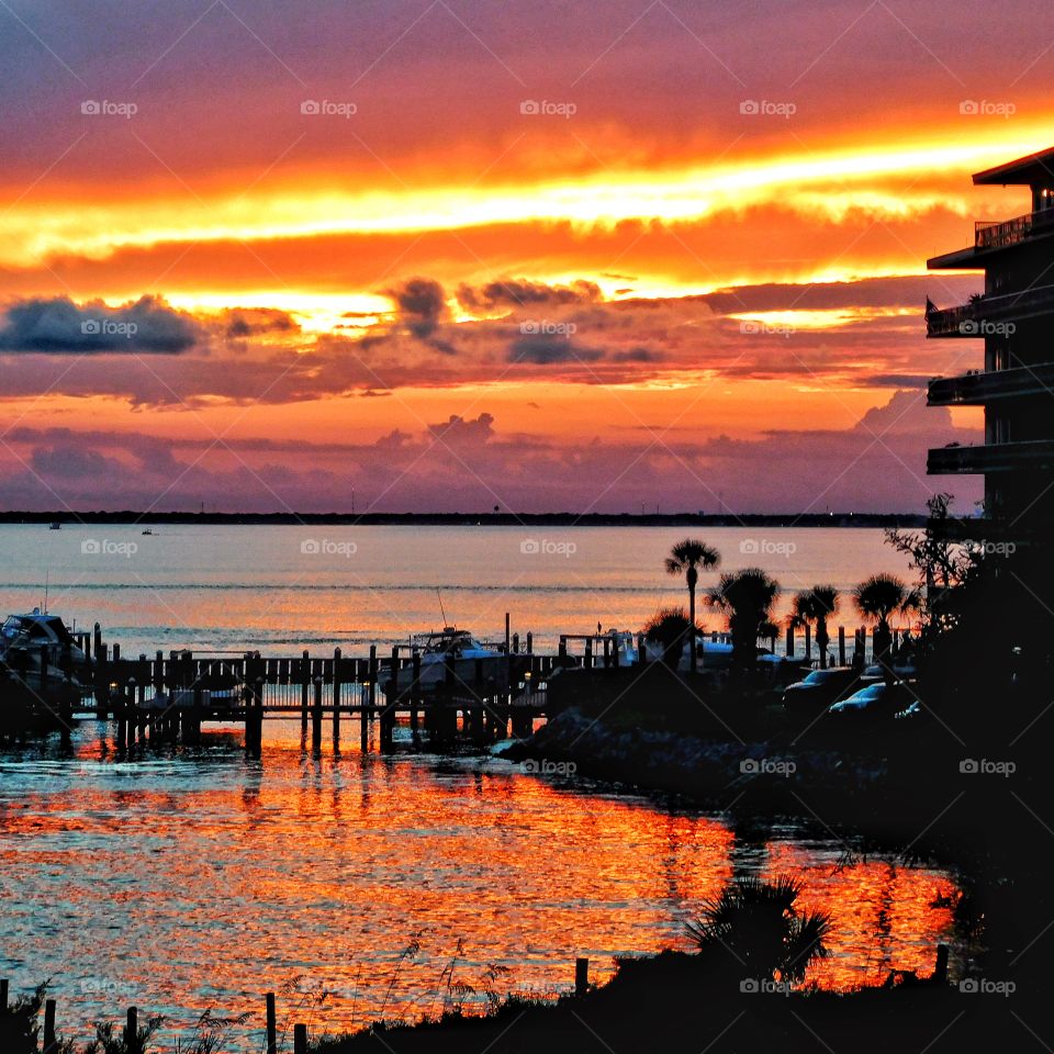 Beauty at dusk! A magnificent sunset sprawls across the surface of the bay!