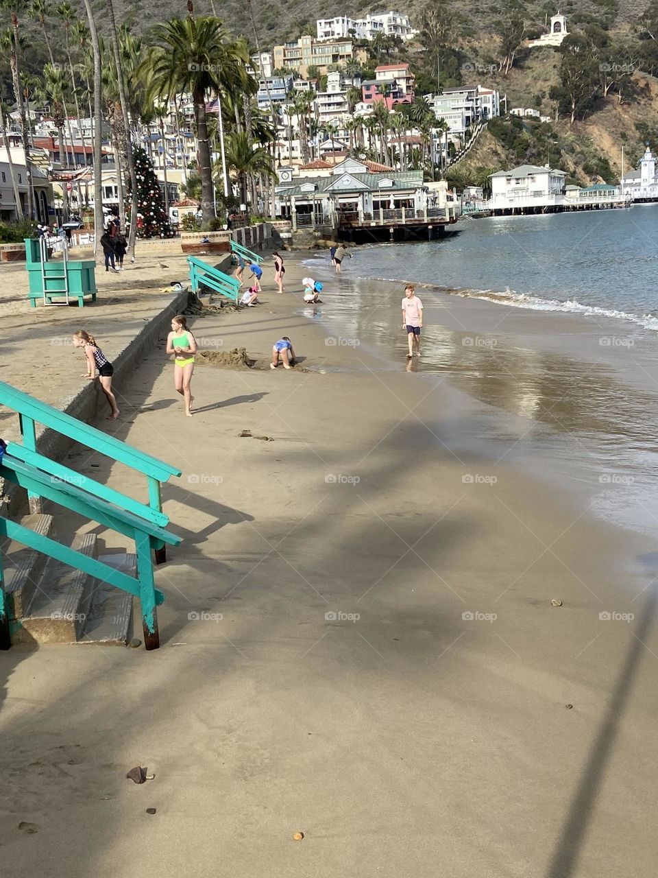 Children playing in the sand on a lazy summer day on Catalina Island off the coast of California.