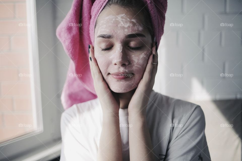 Close-up of woman with face pack