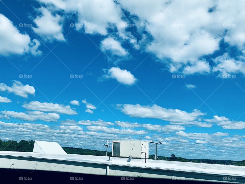 Blue sky with beautiful white fluffy clouds 