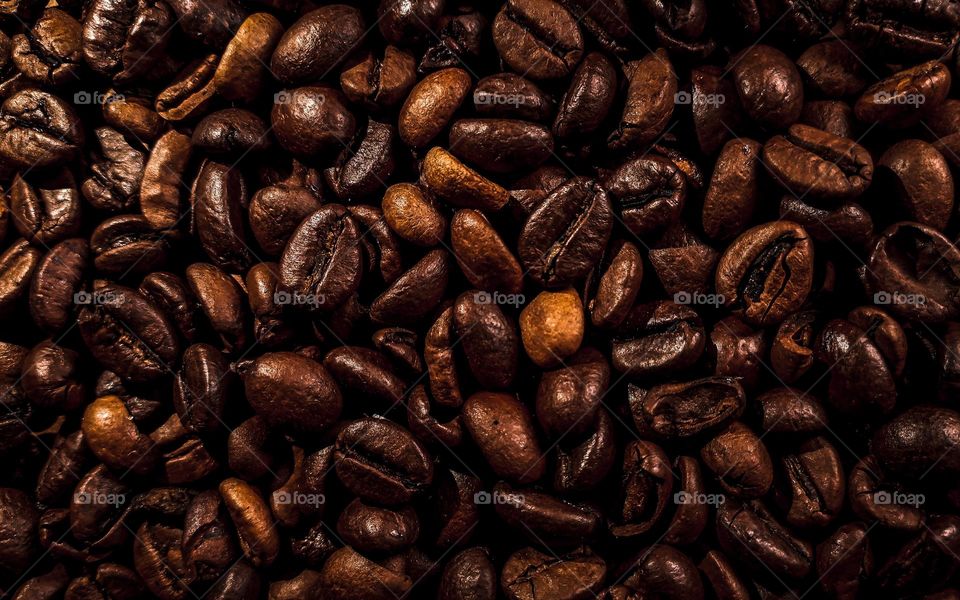 Coffee beans background. Full frame of aromatic roasted coffee beans.