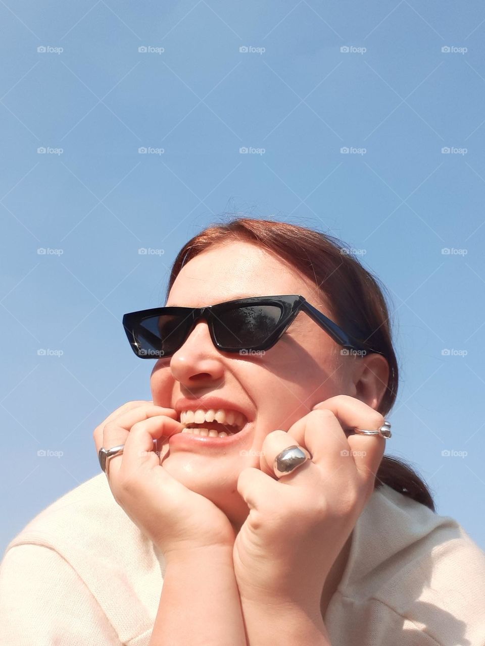 funny portrait of a white-skinned girl in sunglasses