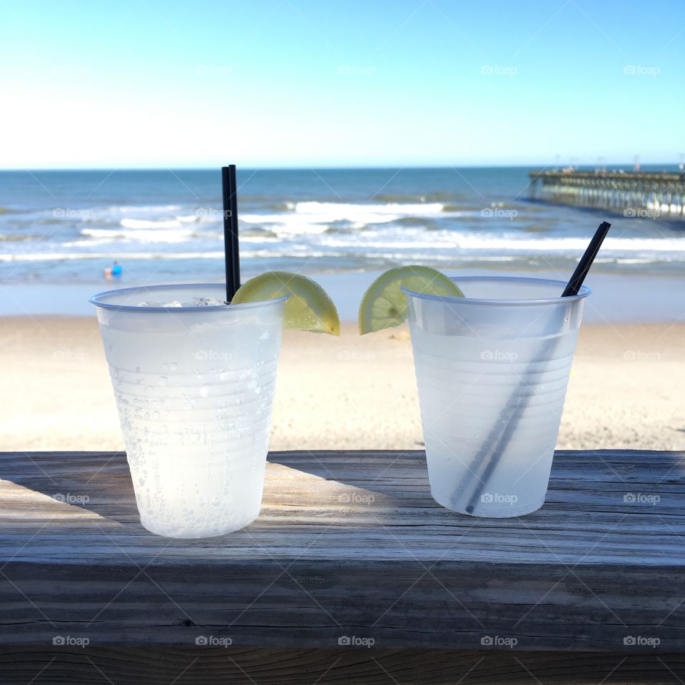 Gin and tonic drinks by the beach 