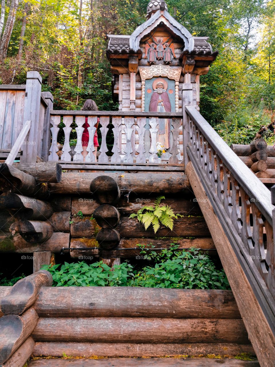 Wooden staircase towards an icon