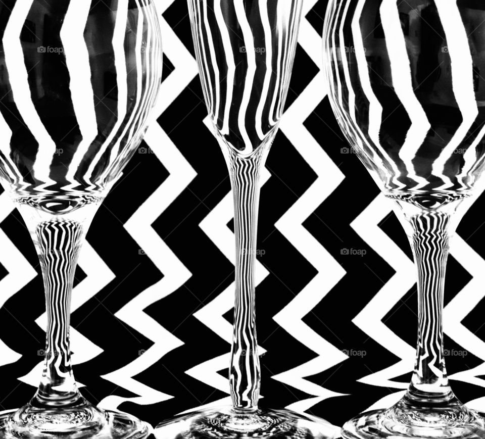 Three glasses against a black and white background 