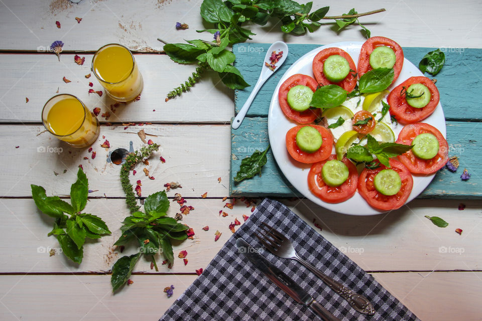 High angle view of salad with orange juice