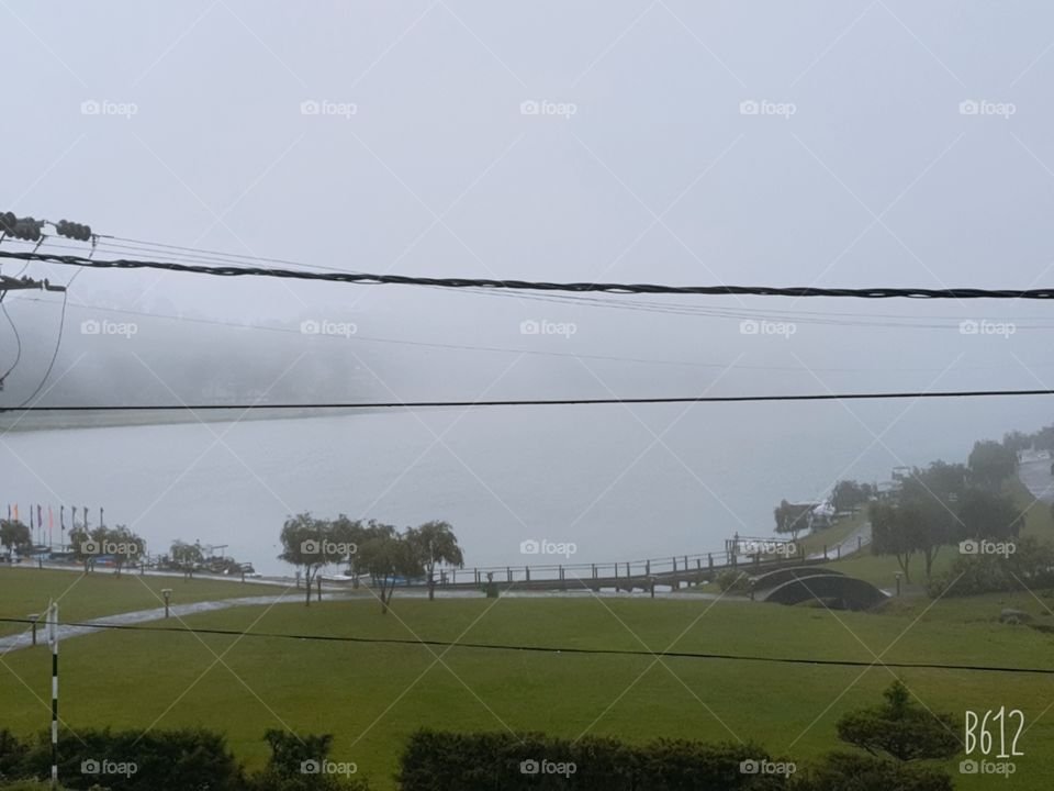 An area and a lake covered by mist.