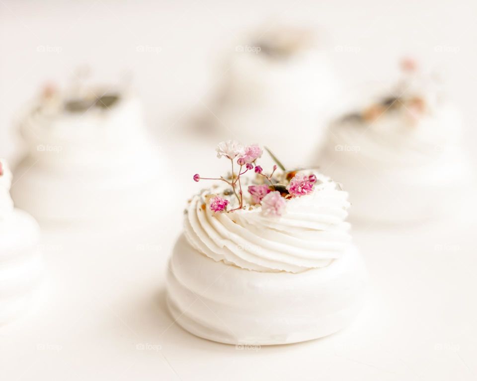 white dessert pavlova cake with meringue and cream