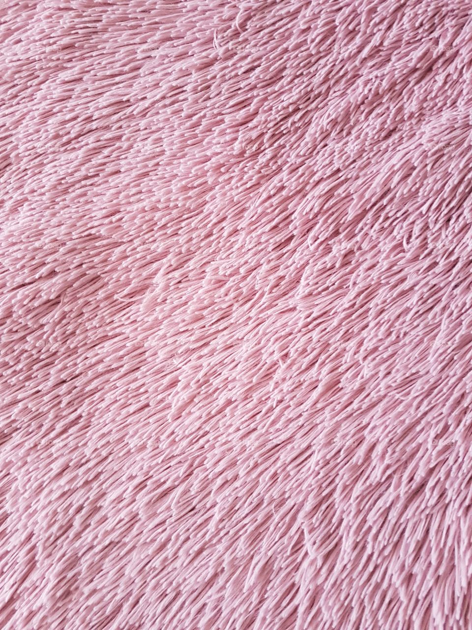 Full frame of pink fluffy carpet