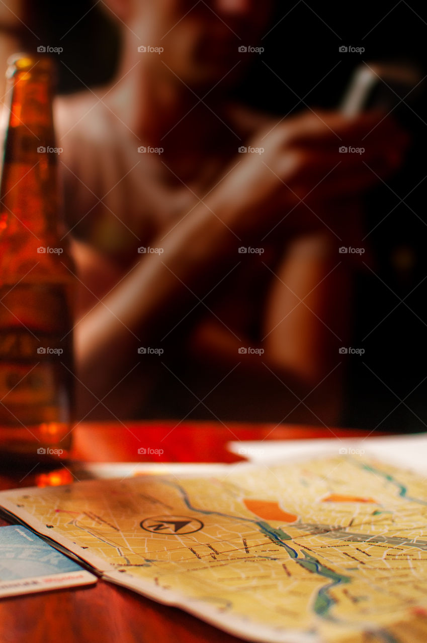 Map and beer on a table