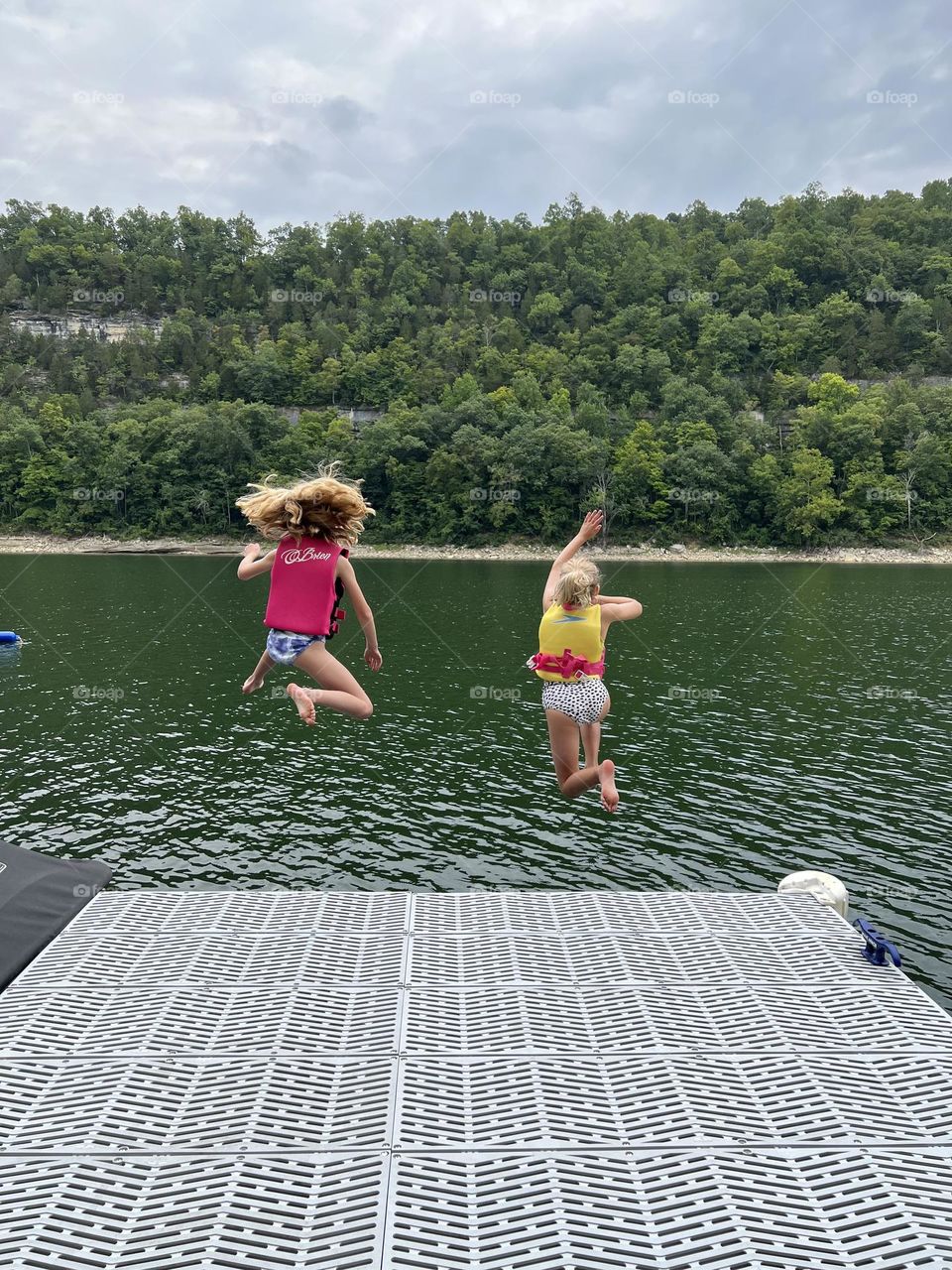 Two friends making summer childhood memories 