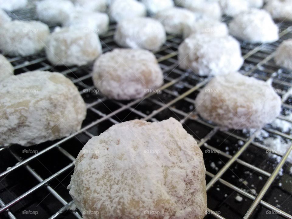 Russian Tea Cakes. fresh baked cookies, made from scratch, on the cooling rack.