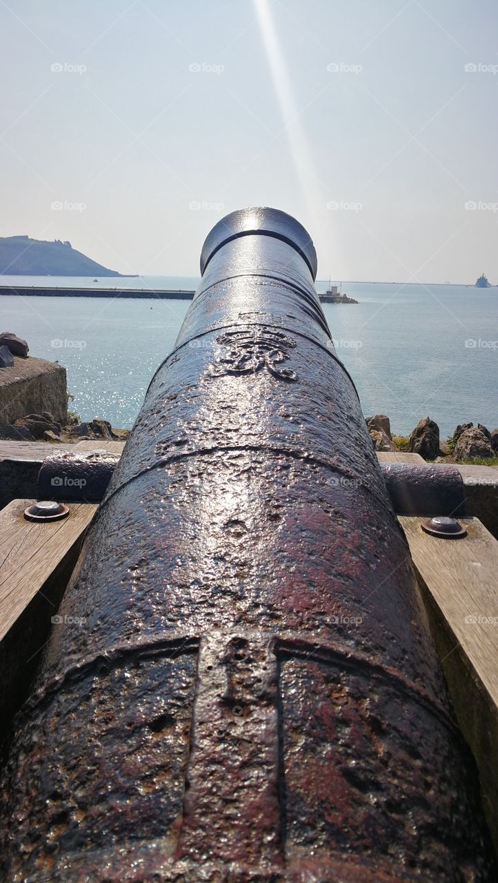 Historic canon overlooking water