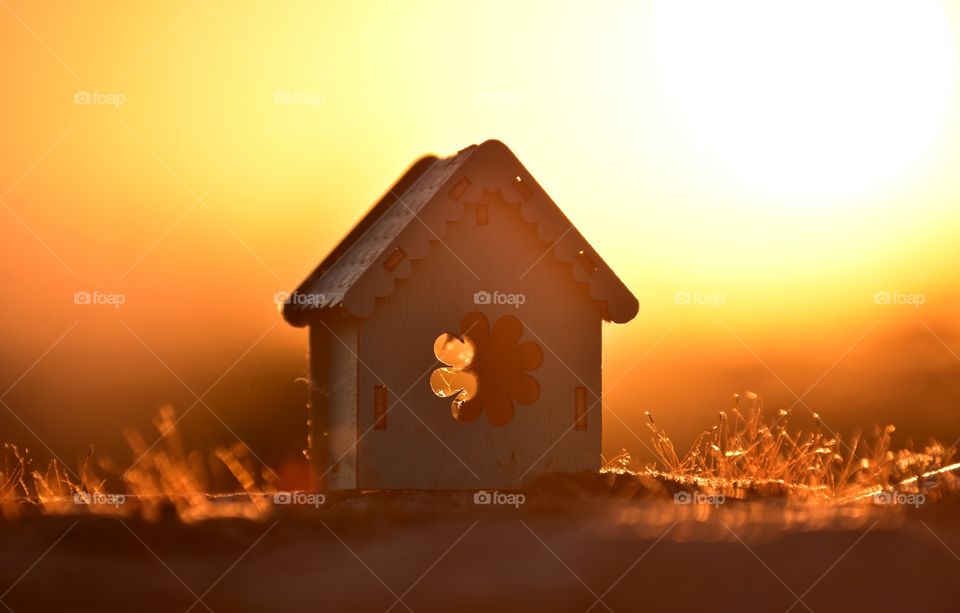 wooden house on sunset background