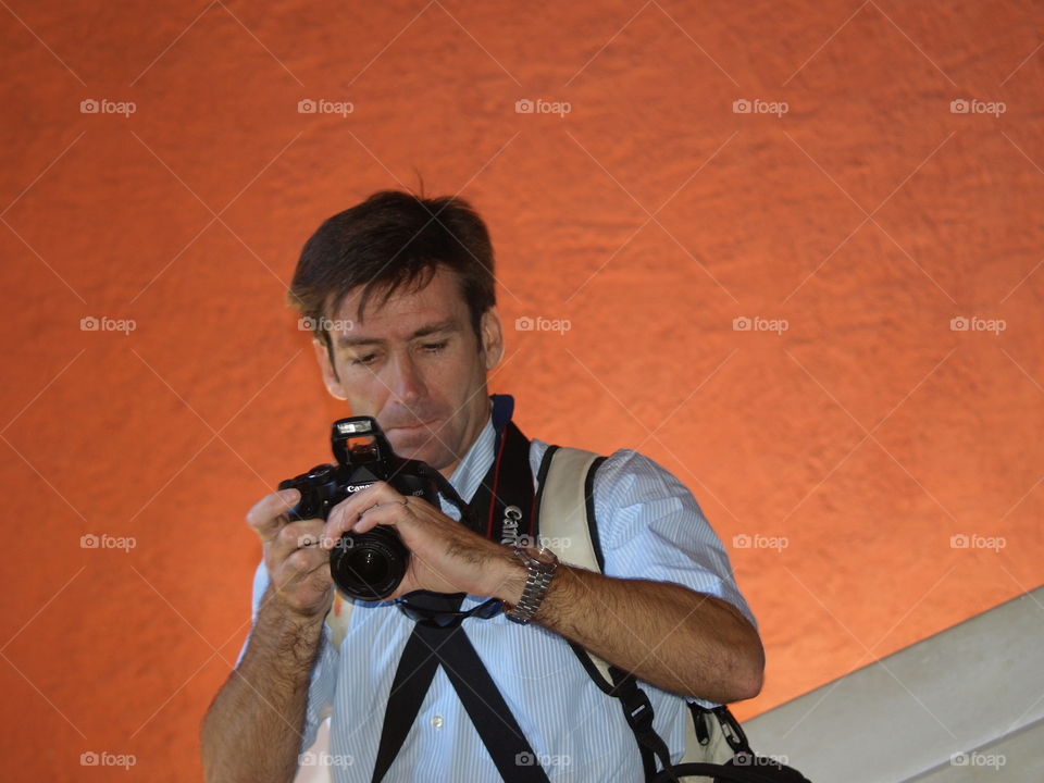 Close-up of photographer with camera
