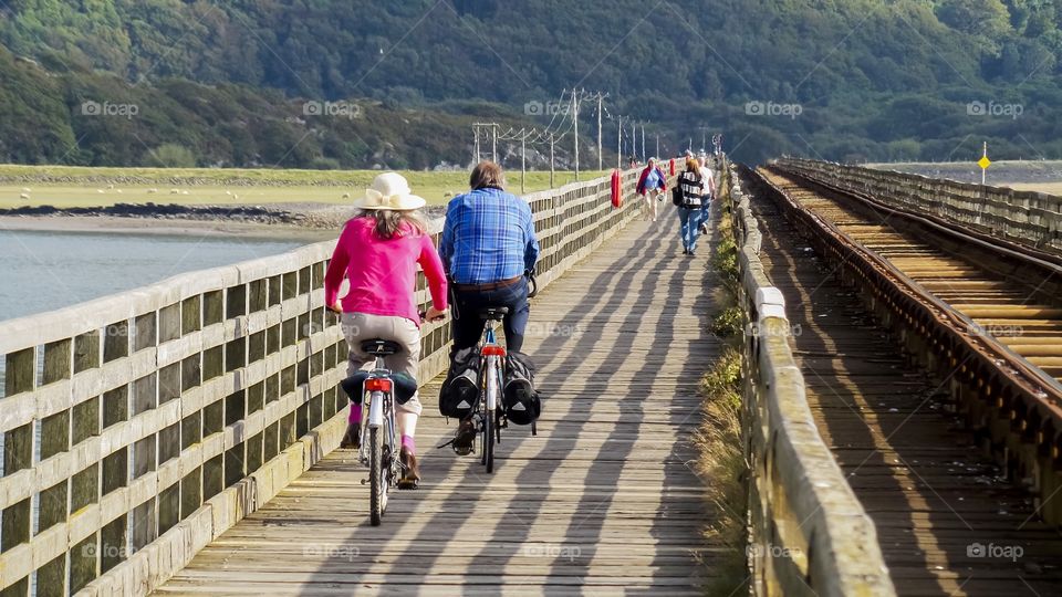 Cyclist on wooden bridge at UK