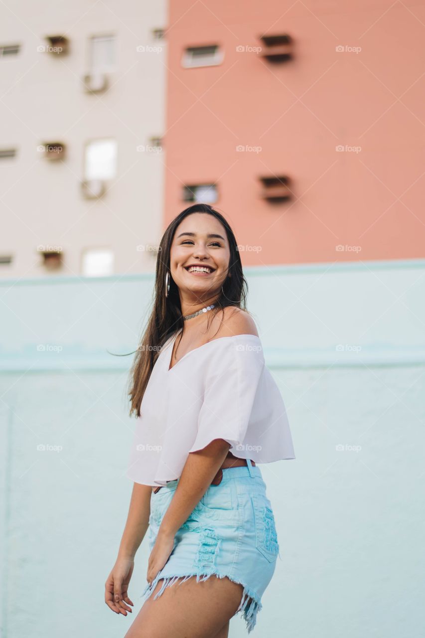 woman walking and laughing in the city