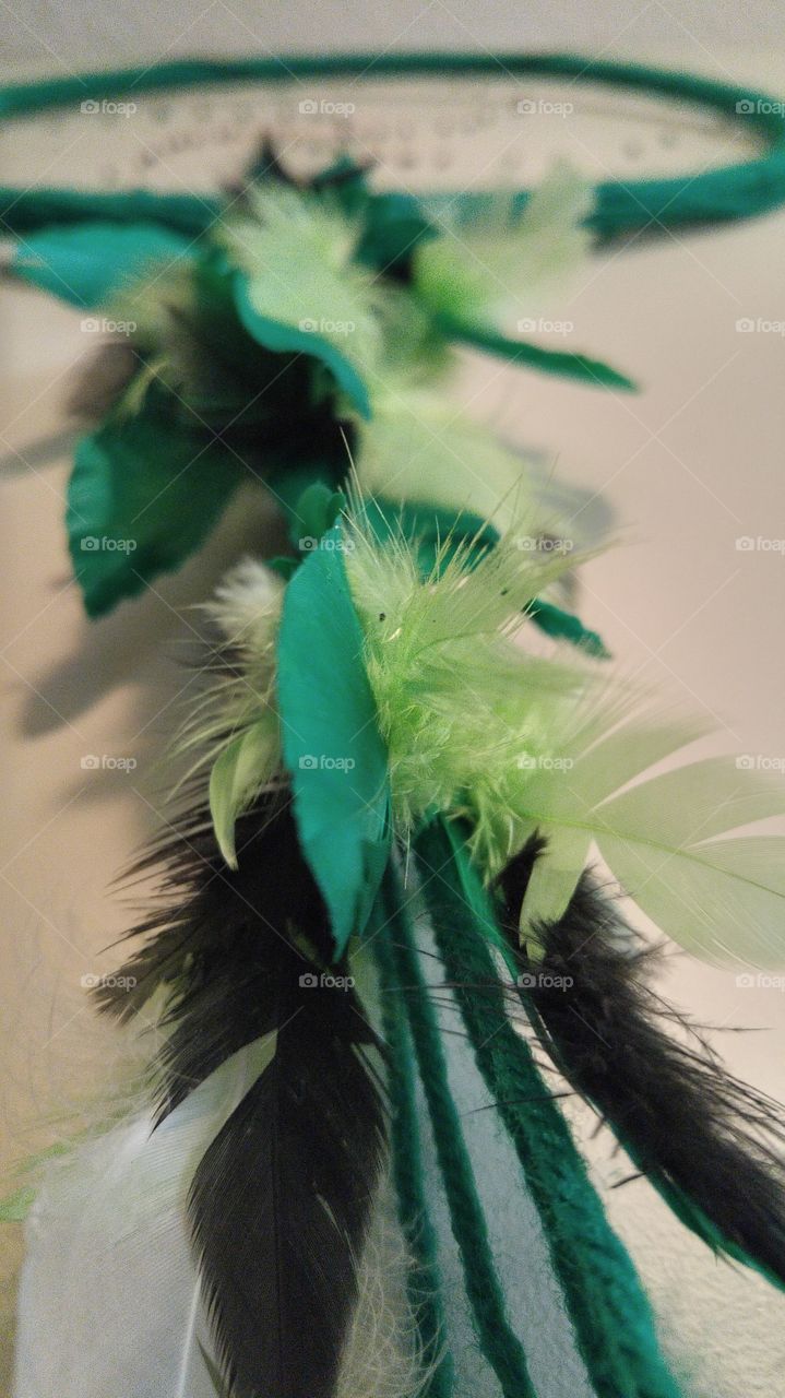 green and black feather dream catcher