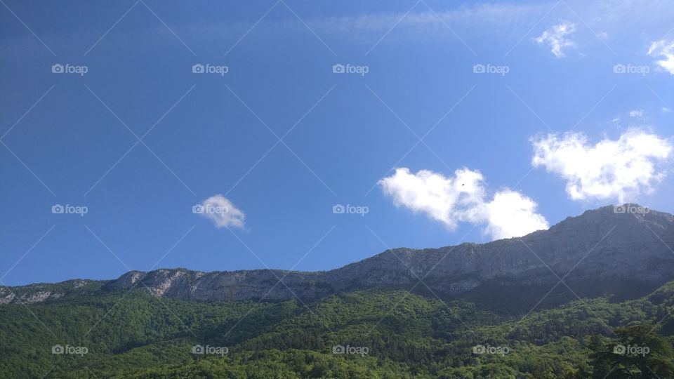 Beautiful Mountains and clear blue Sky with clouds
