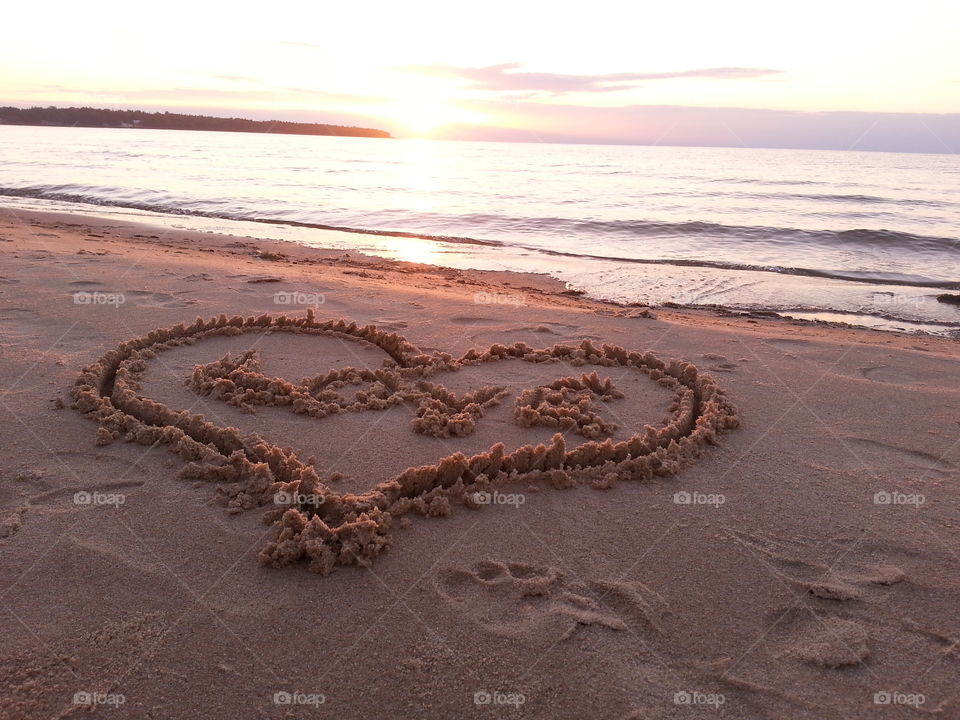 Heart shape drawn on sand