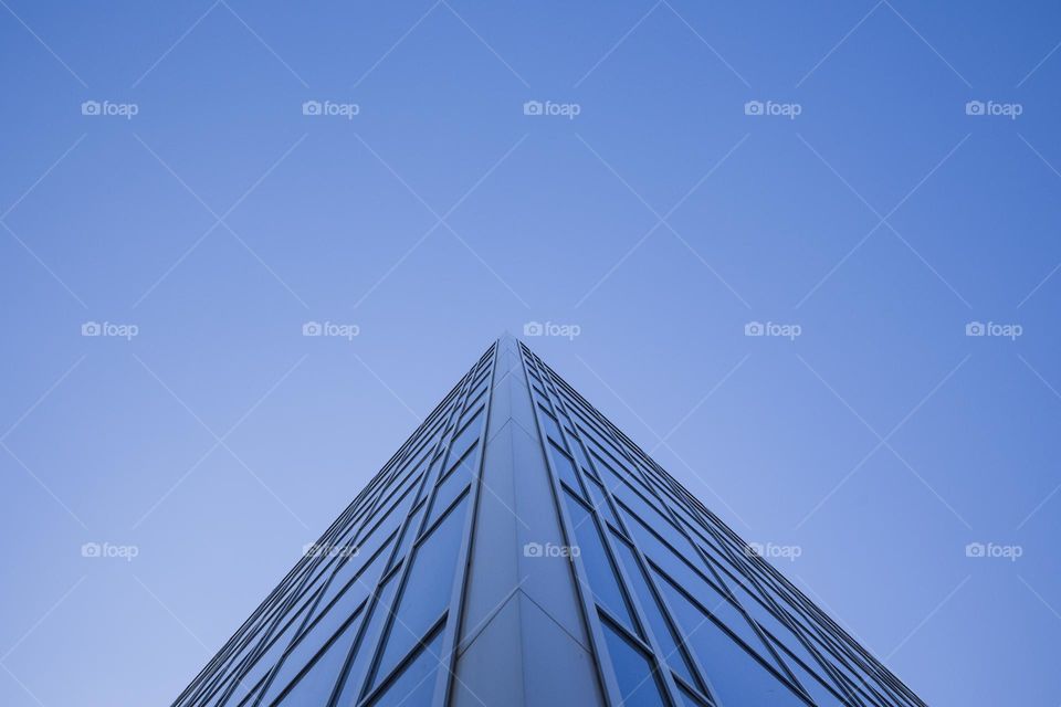 Low angle view of blue modern building against sky