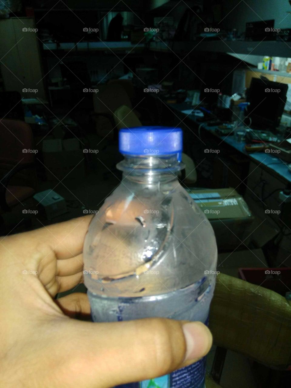 bislary water  bottle in Hand