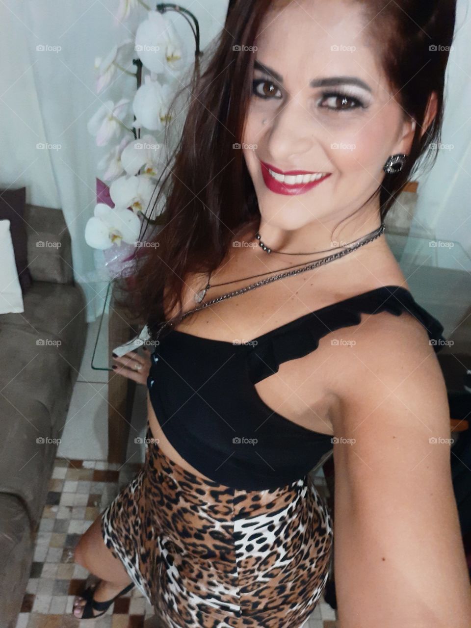 smiling and happy woman in animal print clothes